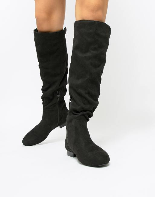 ASOS DESIGN – Connie – Kniehohe Stiefel ausLammfell-Imitat