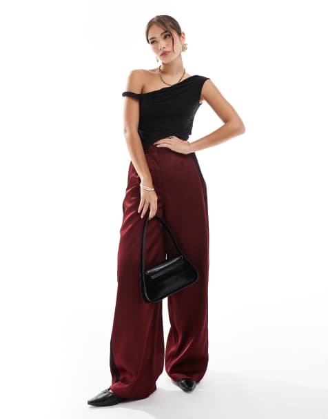 ASOS DESIGN contrast panel satin pants in burgundy - view 1