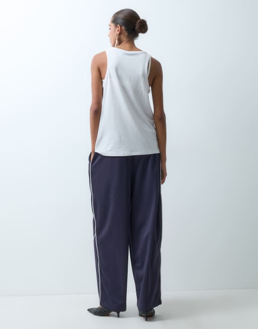 ASOS DESIGN contrast piping sporty trackies in navy, 2 of 5