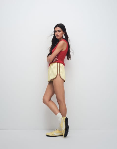 ASOS DESIGN contrast seam satin runner shorts in yellow and mocha - view 1