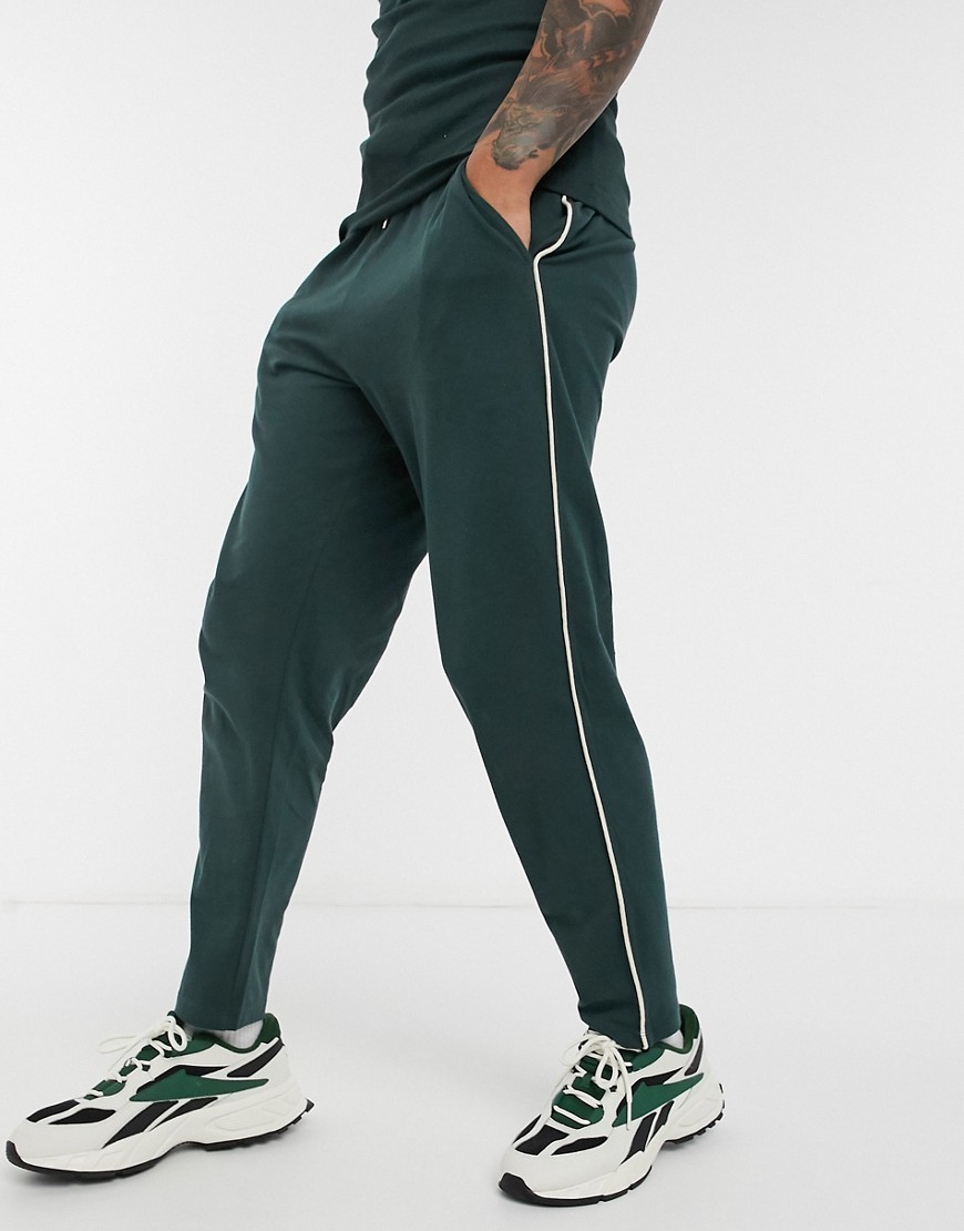 ASOS DESIGN cool coordinating skinny sweatpants in pique with fixed hem and cream piping-Green