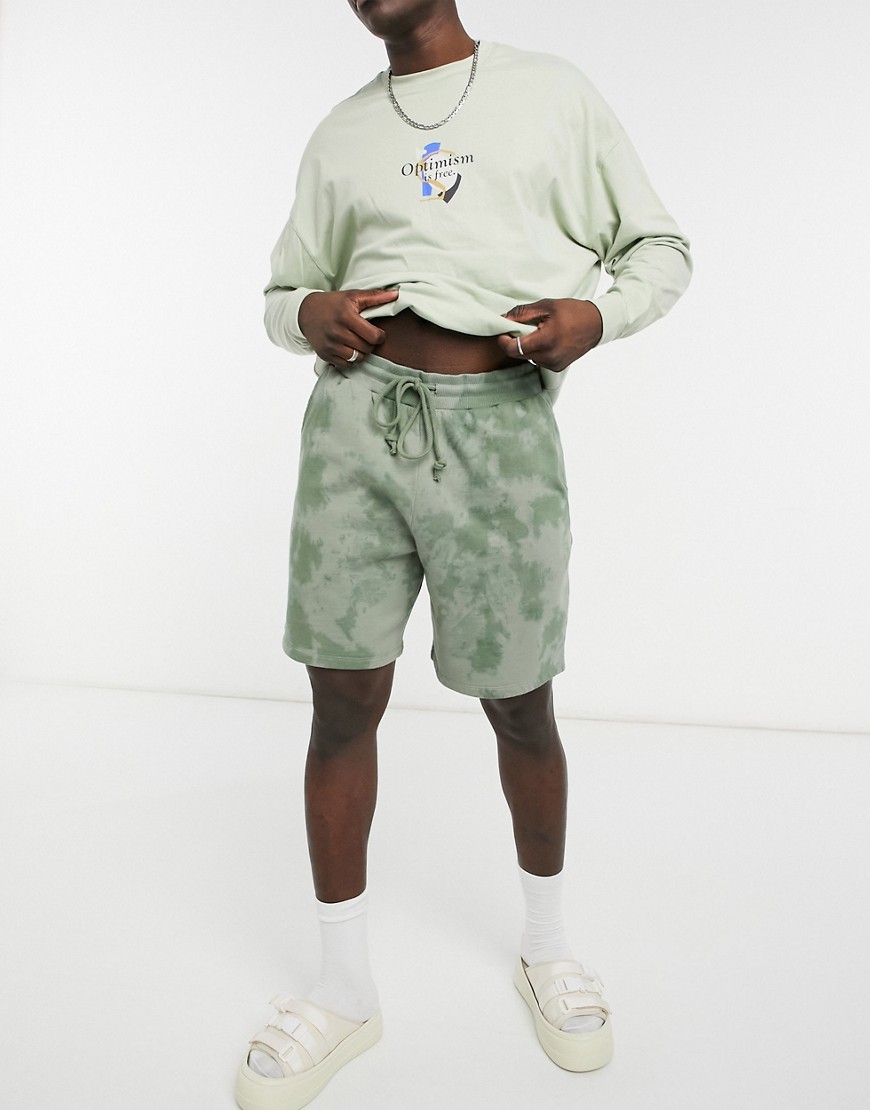 ASOS DESIGN coordinating oversized jersey shorts in tonal green tie-dye