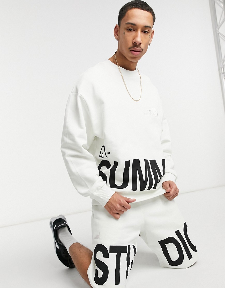 ASOS DESIGN coordinating oversized jersey shorts with large text print-Grey