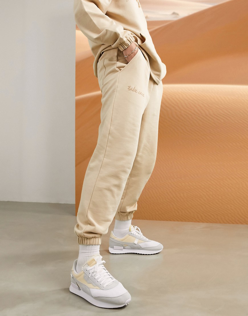 ASOS DESIGN coordinating oversized sweatpants with side print-Neutral