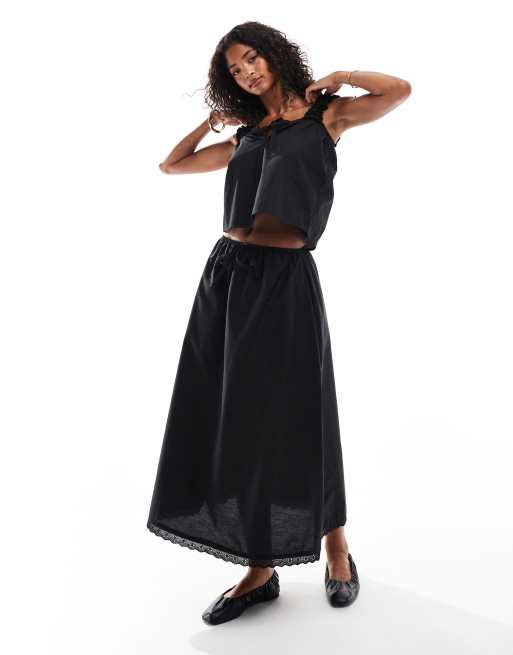 ASOS DESIGN - Coordinato in cotone nero con top grembiule e gonna lunga