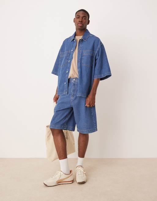 ASOS DESIGN - Coordinato in denim blu lavaggio medio con jorts e camicia oversize a maniche corte con tasche applicate
