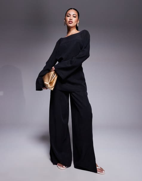 ASOS DESIGN - Coordinato morbido comodo con pantaloni con fondo ampio e top nero slavato - view 1