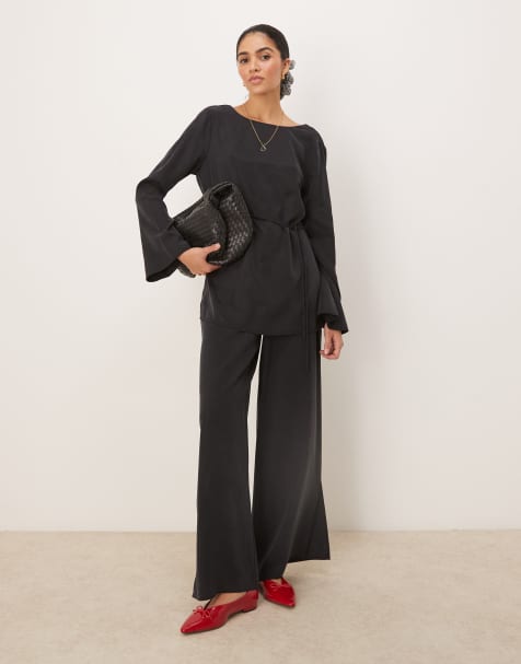 ASOS DESIGN - Coordinato morbido comodo con pantaloni con fondo ampio e top nero slavato - view 1