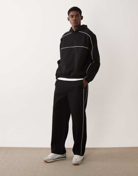 ASOS DESIGN - Coordinato nero con profili a contrasto composto da felpa super oversize con cappuccio e joggers a fondo ampio - view 1