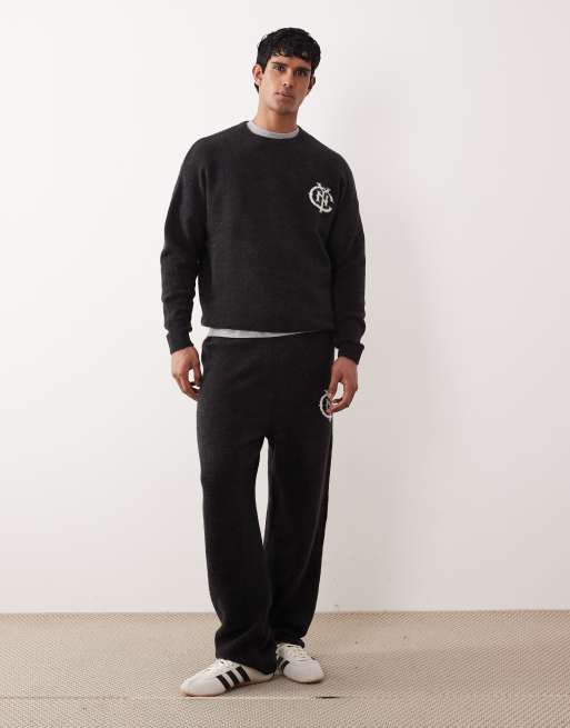 ASOS DESIGN - Coordinato nero slavato con joggers e maglione lavorato oversize con stampa NYC