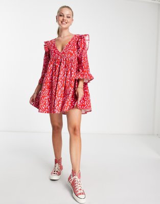 asos design cord mini smock dress with ruffle shoulder in red abstract print