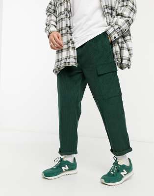 ASOS DESIGN relaxed cargo pants in dark green cord