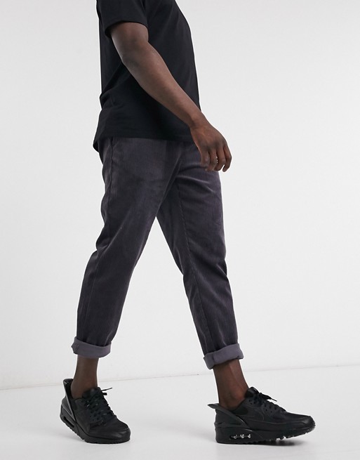 ASOS DESIGN cord slim trousers with elasticated waist in charcoal