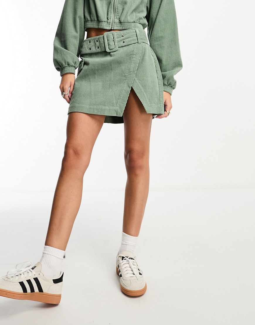 ASOS DESIGN cord wrap mini skirt in sage co-ord-Green