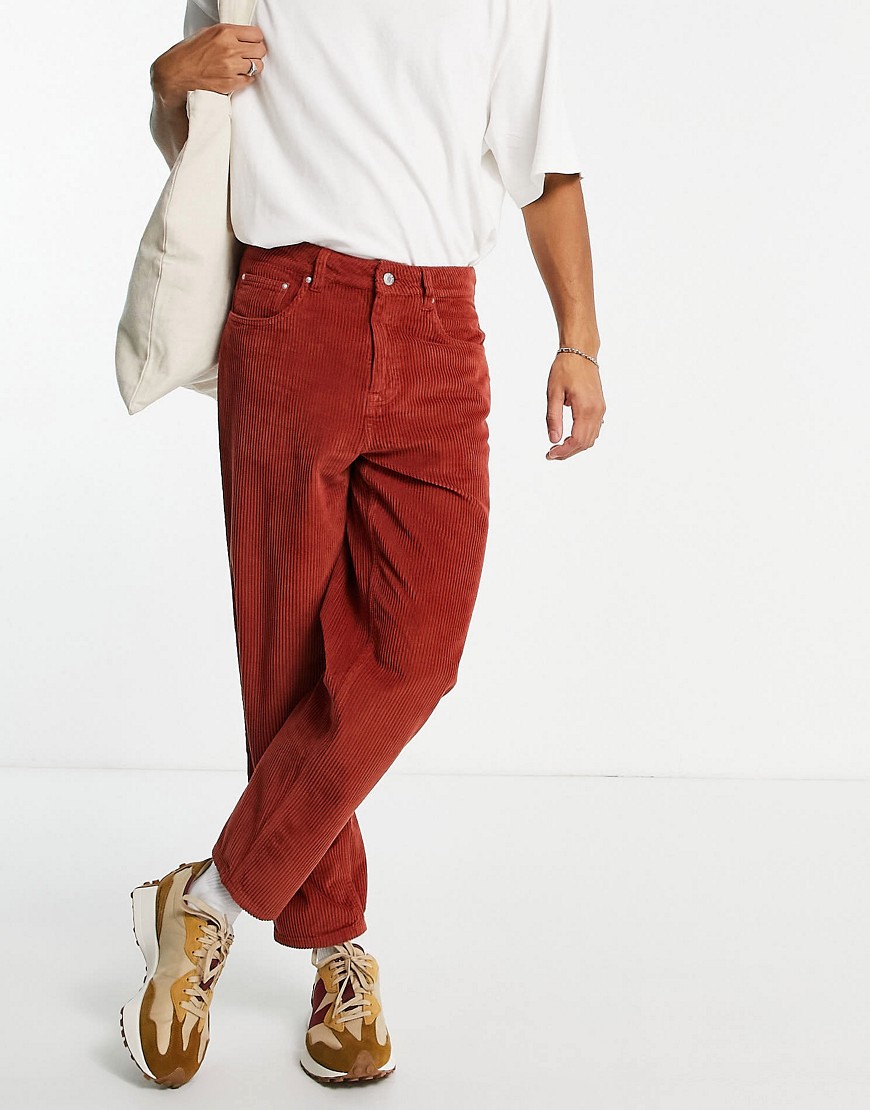 ASOS DESIGN corduroy relaxed tapered jeans in rust-Orange