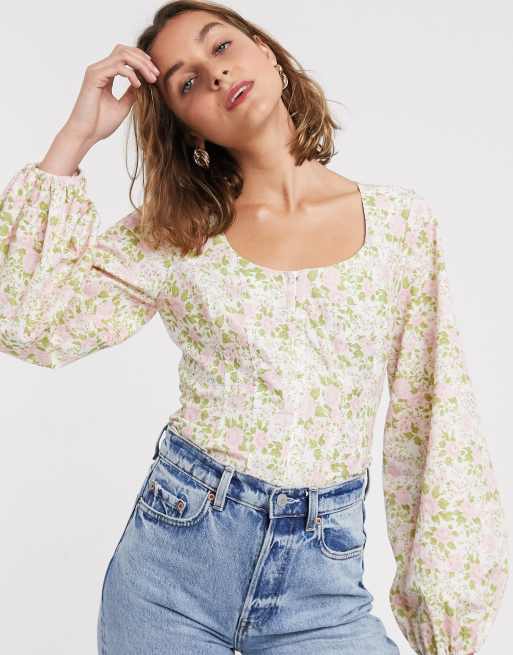 ASOS DESIGN corset detail top with bell sleeve in floral print