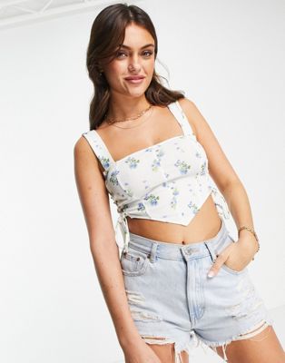 ASOS DESIGN corset detail top with ruched sides in blue ditsy floral print