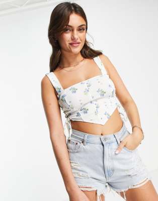 ASOS DESIGN corset detail top with ruched sides in blue ditsy floral