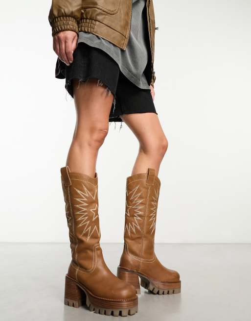 Knee high hot sale cleated boots