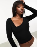 [ASOS DESIGN] ASOS DESIGN cotton asymmetric scooped neck long sleeved crop top in black 8 Black