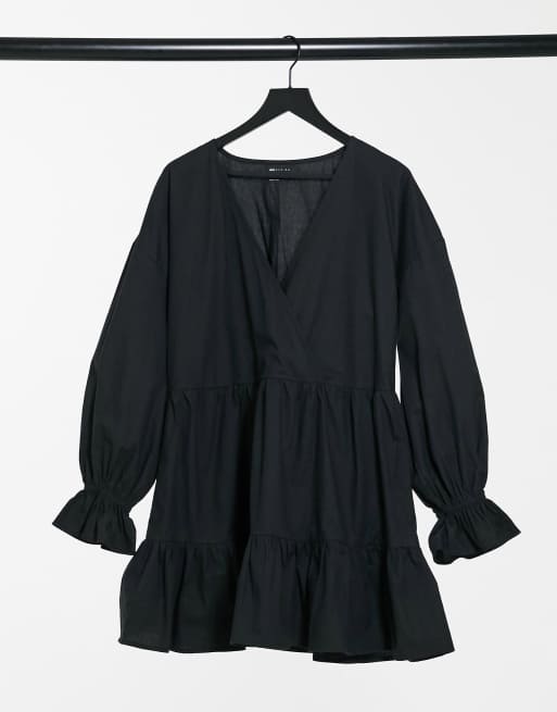 ASOS DESIGN cotton poplin casual wrap front tiered mini smock dress with long sleeve in black