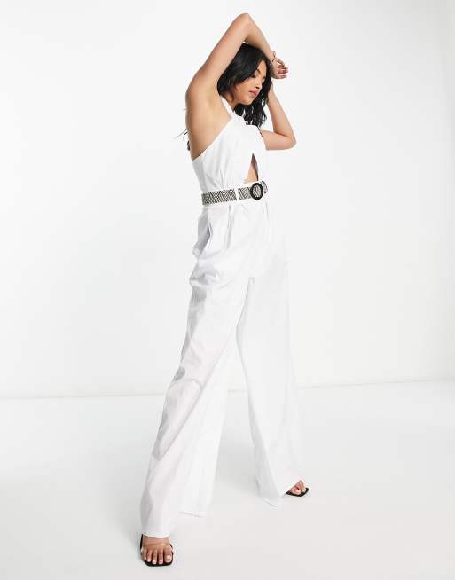 ASOS DESIGN textured halter jumpsuit with belt and large pocket in