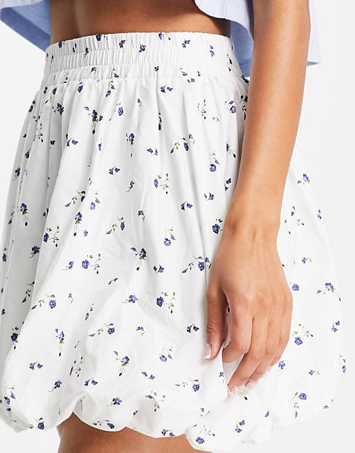 Women cotton puffball mini skirt in floral print 
