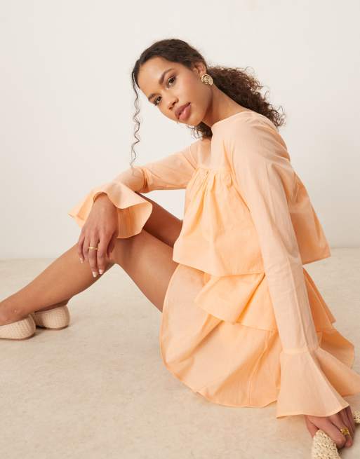 ASOS DESIGN cotton ruffle cutout romper in peach
