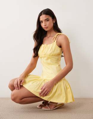 ASOS DESIGN cotton sateen tie bust dropped waist mini sundress in butter yellow 