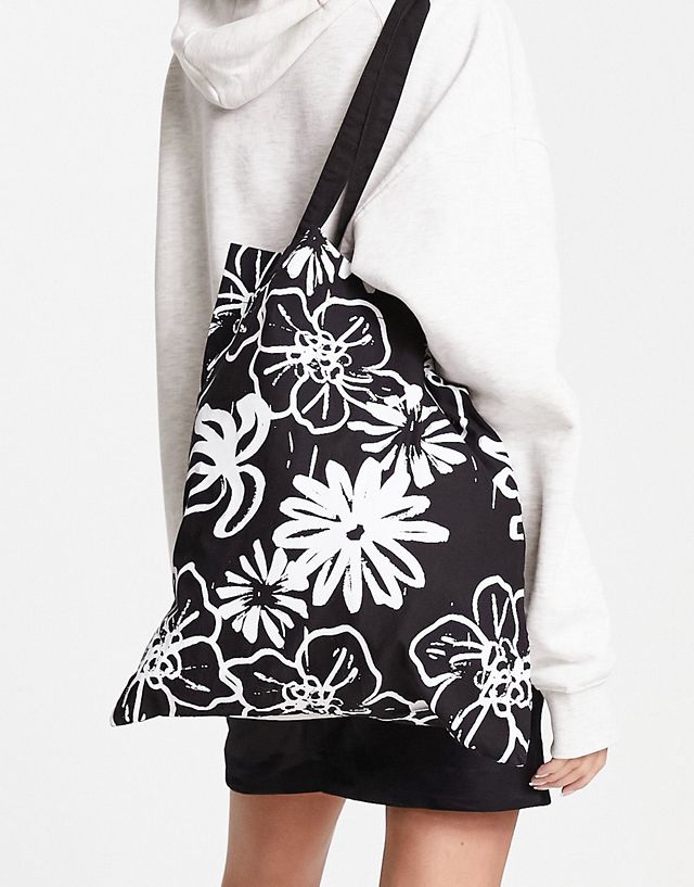ASOS DESIGN cotton tote bag in abstract floral in black