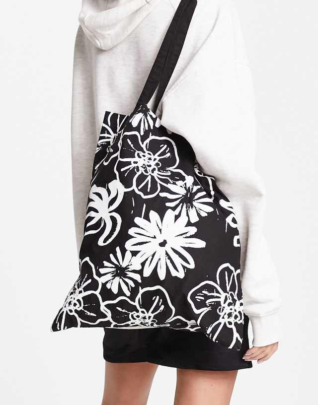 ASOS DESIGN cotton tote bag in abstract floral in black