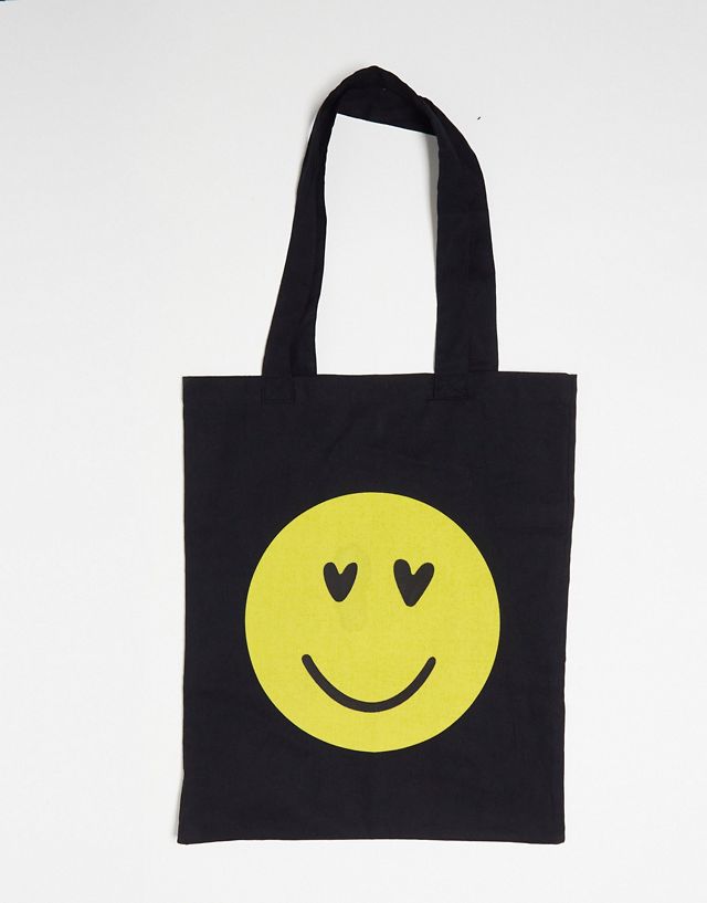 ASOS DESIGN cotton tote bag with happy face in black