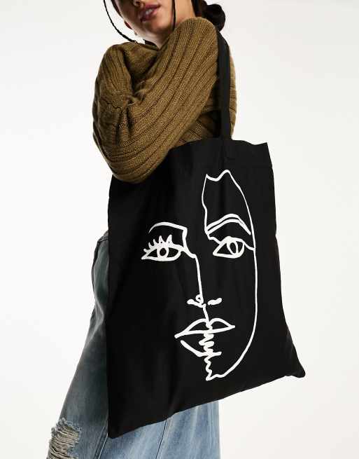 ASOS DESIGN cotton tote bag with placement abstract face print