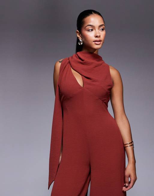 ASOS DESIGN cowl draped neck wide leg jumpsuit with tie detail in rust