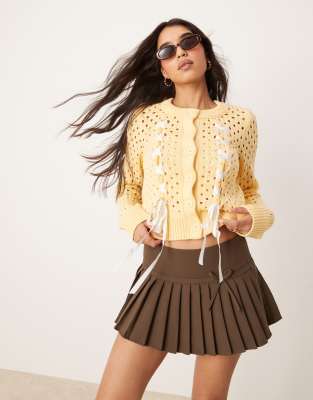 Asos Design Crew Neck Cardigan In Open Stitch With Bow Detail In Yellow