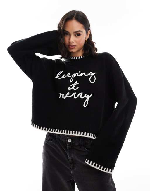 ASOS DESIGN crew neck jumper with blanket stitch and christmas slogan in black and white