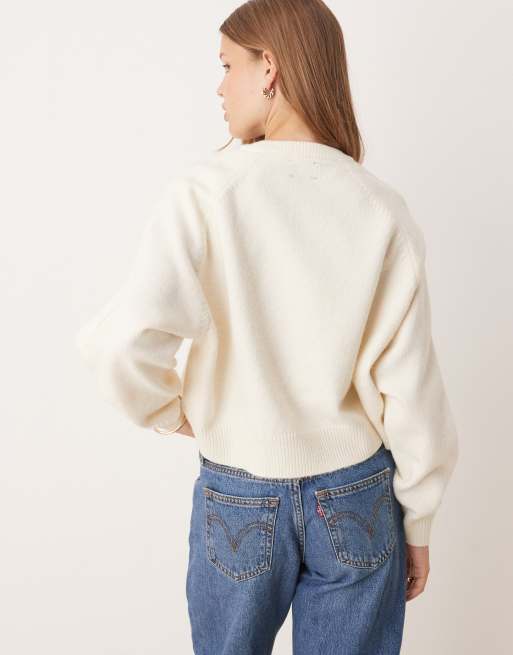 ASOS DESIGN crew neck sweater with raglan and fisherman ribbed sleeve detailing in cream