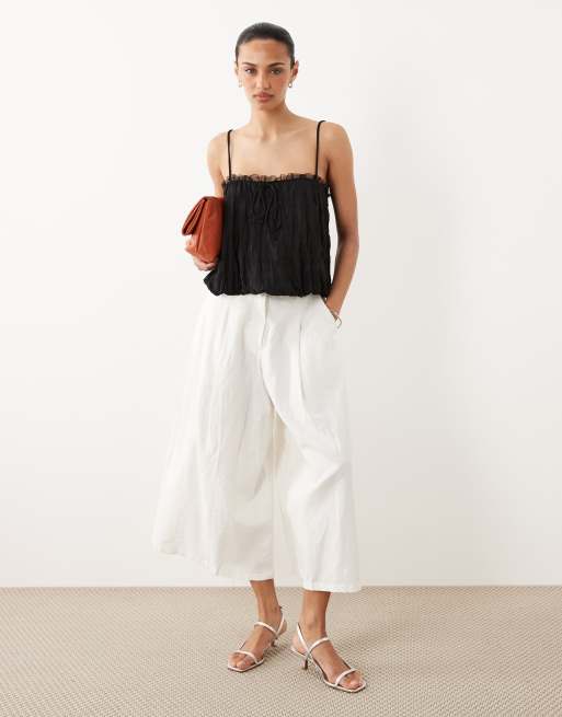 ASOS DESIGN crinkle cami top with bubble hem and mesh trim in black, 2 of 4