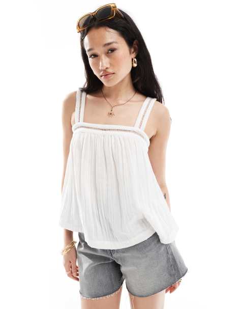 ASOS DESIGN crinkle cami top with lace insert detail and tie back in white