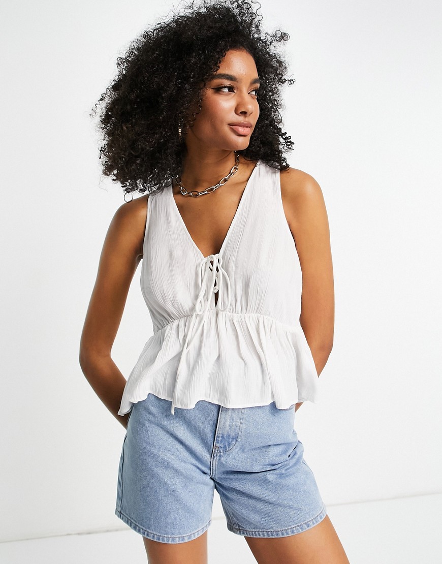 ASOS DESIGN crinkle cami with lace up front and peplum hem in white