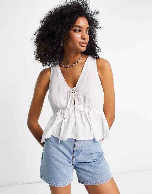 ASOS DESIGN crinkle cami with lace up front and peplum hem in