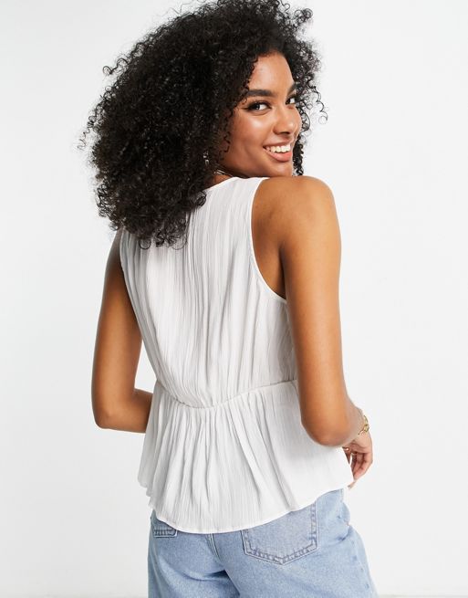 ASOS DESIGN crinkle cami with lace up front and peplum hem in