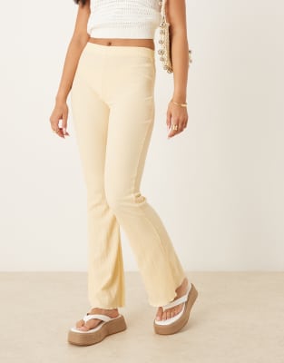 ASOS DESIGN crinkle flare trouser in buttermilk yellow - view 1