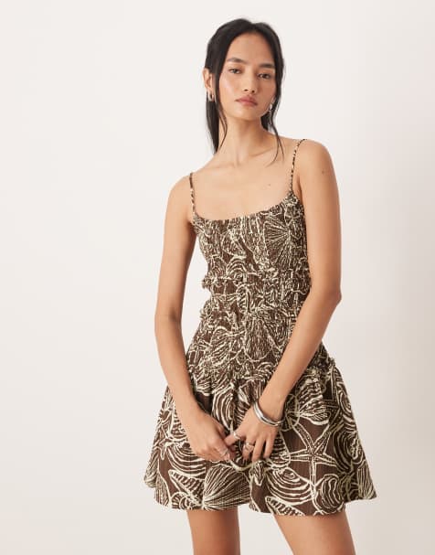 ASOS DESIGN crinkle mini sundress with shirred dropped waist in chocolate shell print 