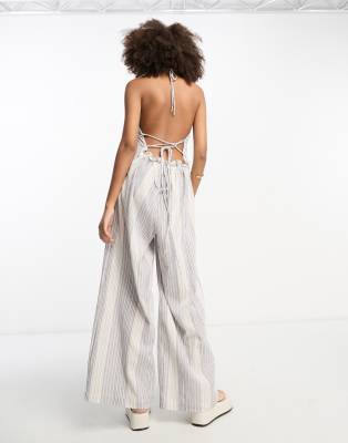 ASOS DESIGN crinkle ruffle halterneck jumpsuit with wide leg