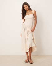 ASOS DESIGN babydoll mini dress with ruffle hem in orange