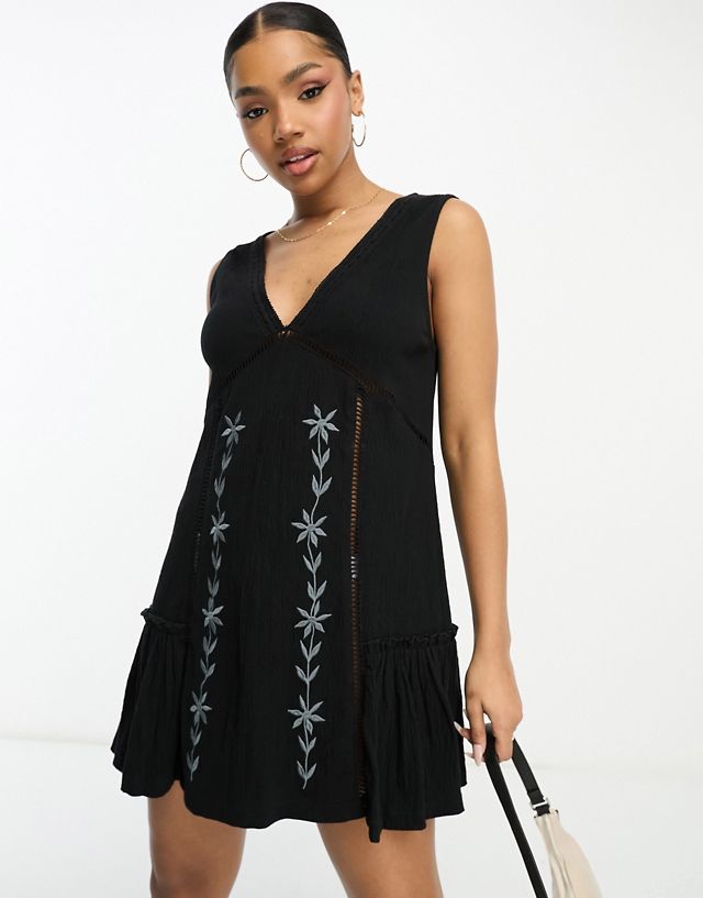 ASOS DESIGN crinkle sleeveless mini dress with embroidered contrast panel in black