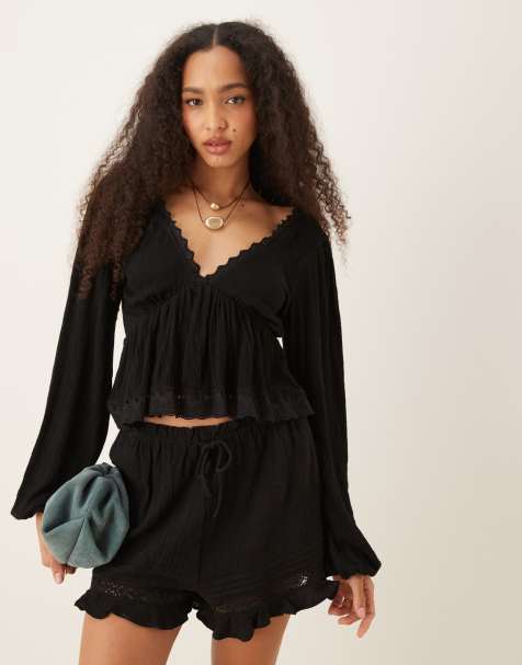 ASOS DESIGN crinkle tie back balloon sleeve top with lace trim in black 