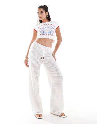 ASOS DESIGN crochet look wide leg trousers with wooden button detail in ecru-White