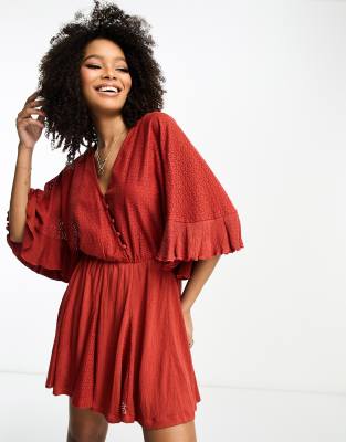 Shop Asos Design Crochet Short Sleeve Wrap Mini Dress With Buttons In Orange